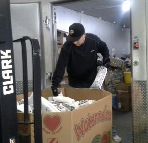 HSH Warehouse Manager, Jared Slusser putting the donated meat in our freezer.